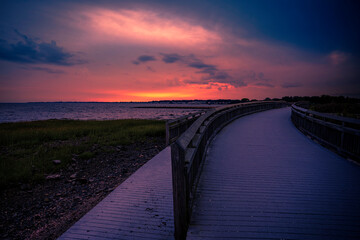 Milford Connecticut Sunset Seascape along the curving boardwalk at Silver Sands State Park, Charles Island view on Long Island Sound Beach