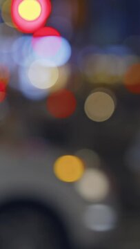 Manhattan street at night, colorful lights, pedestrians and vehicles, vertical reels