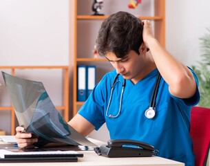 Young handsome doctor radiologyst working in clinic