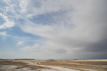 Cloudy sky at dawn in the morning in the Kazakh steppe, dawn in the wild desert