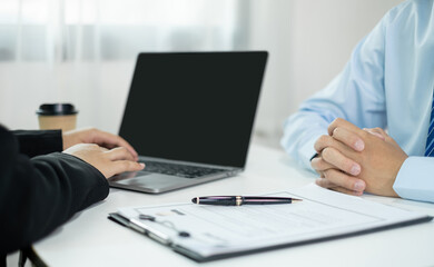 Business people hold a resume and talk to job applicants for job interviews about careers and Their personal history in the company. Recruitment concepts