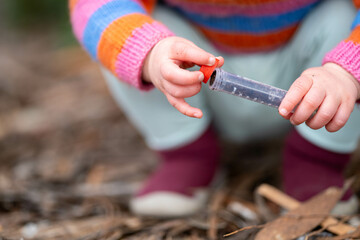 toddler with test tube learning science