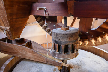 The original, wooden mechanism of an old Greek windmill, grain mill
