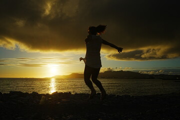 Woman seating in Sunset Image of Agarie Beach in Nago, Okinawa, Japan - 日本 沖縄 名護...