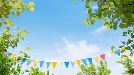 Colorful pennant string decoration and balloon garland decoration elements in green tree foliage