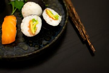 Luxurious and creative Sushi as Nigiri, Futomaki, Uramaki with Bamboo chopsticks