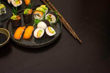 Luxurious and creative Sushi as Nigiri, Futomaki, Uramaki with Bamboo chopsticks