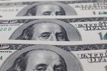 A large photo of hundred-dollar bills. Dollars, savings, financial assets