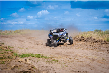 UTV in action offroad vehicle racing on sand dune. Extreme, adrenalin. 4x4.