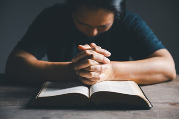 Worship christian with bible concept. Young woman person hand holding holy bible with study at home. Adult female christian reading book in church. Girl learning religion spirituality and pray to god.