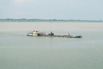 Fishing boat on the Mekong river in Phnom Penh, Cambodia