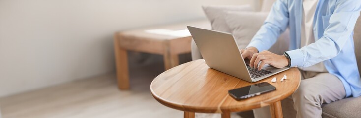 Home office, Businessman typing data on laptop about strategy and planning of new business