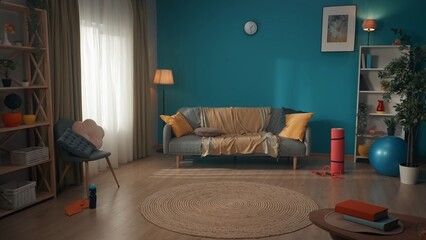 A cozy small room with a modern design. Filled with daylight accented by a blue wall. The room is filled with various decor. On the floor lies sports equipment for fitness. Living room.