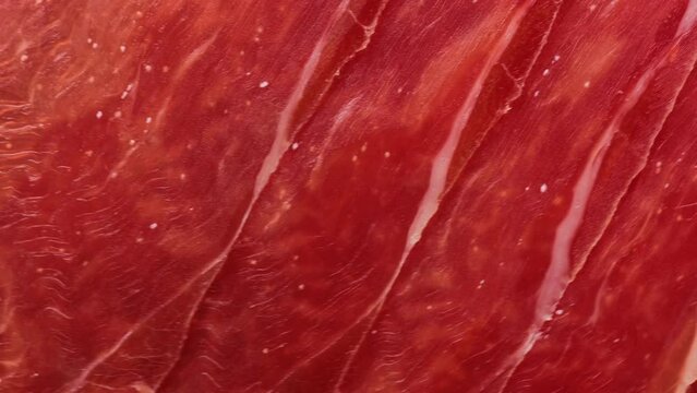 italian jamon, rotation in circle. slices of Turning meat. selective focus	
