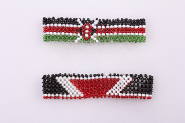 Hand bracelets with Kenyan Flag on a white background in Kenya East Africa Texture details symmetry patterns