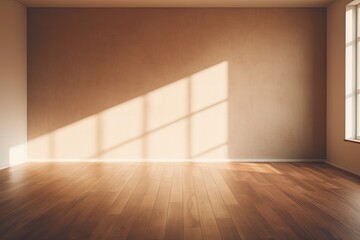 Sunlight falling into an empty room with a brown mock up wall.