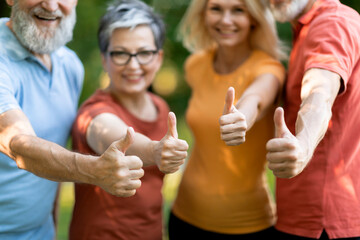 Happy Senior People In Sportswear Showing Thumbs Up At Camera, Standing Outdoors