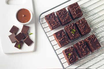 Delicious chocolate brownies with mint on white background. Sweet cake concept. 