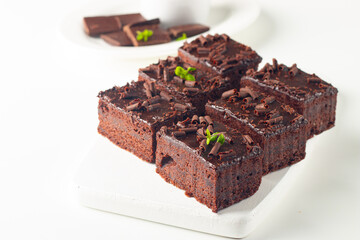 Delicious chocolate brownies with mint on white background. Sweet cake concept. 