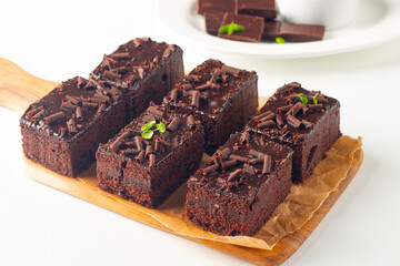 Delicious chocolate brownies with mint on white background. Sweet cake concept. 