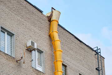 Waste chute on facade of building, disposal of construction waste during construction, renovating...