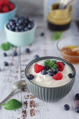 A bowl with Greek yogurt with berries