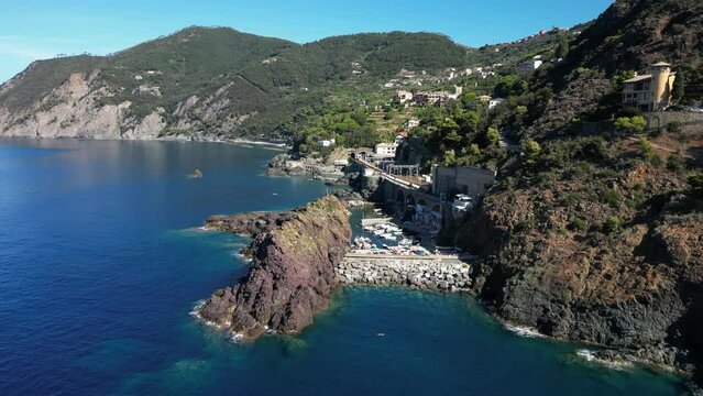 Europe, Italy, Framura is a little sea village in Liguria close to 5 terre ( five island )  - drone aerial view of mediterranean coast - natural harbour and beach 