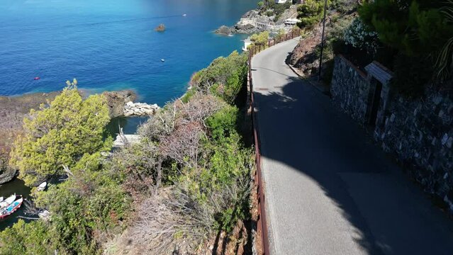 Europe, Italy, Framura is a little sea village in Liguria close to 5 terre ( five island )  - drone aerial view of mediterranean coast - hiking and trekking walking by over the sea 