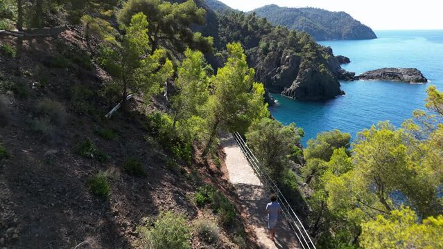 Europe, Italy, Framura is a little sea village in Liguria close to 5 terre ( five island )  - drone aerial view of mediterranean coast - hiking and trekking walking by over the sea 