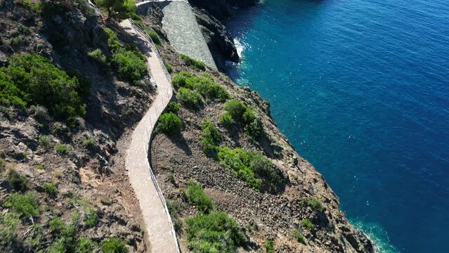 Europe, Italy, Framura is a little sea village in Liguria close to 5 terre ( five island )  - drone aerial view of mediterranean coast - hiking and trekking walking by over the sea 