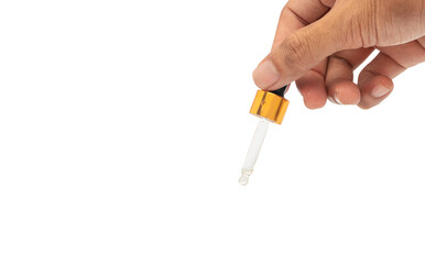 Person's hand holding a cosmetic serum pipette isolated on white background with clipping path.