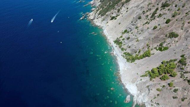Europe, Italy, Framura is a little sea village in Liguria close to % terre ( five island )  - drone aerial view of mediterranean coast - amazing natural bay with beach and boats visiting 