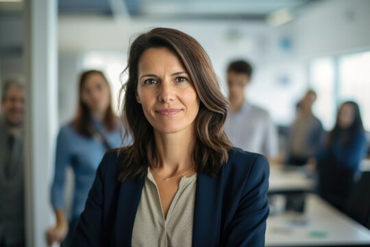 In welllit corporate office, Caucasian woman in middle age confidently presents ideas. Suddenly, she shifts from assertiveness to meekness, demonstration of mood swings that can be hallmark