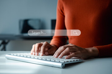 Searching Browsing Internet Data Information with blank search bar.Search Engine Optimization SEO Networking Concept.hand of businessman working with computer laptop on desk in office.