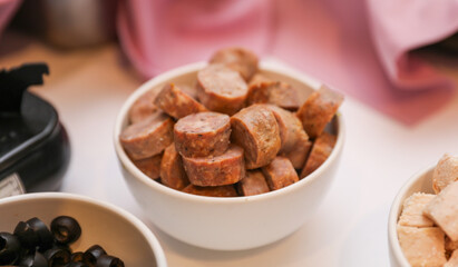 Potluck party with a delightful spread of meat, vegetables, and bread dishes, embodying community and culinary diversity