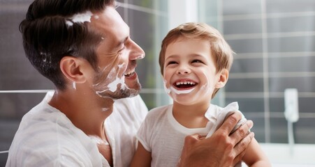 Obraz na płótnie Canvas Son shaving with father in the bathroom