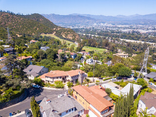 Aerial view of the Los Feliz neighborhood with large houses in the hills and downtown Los angeles...