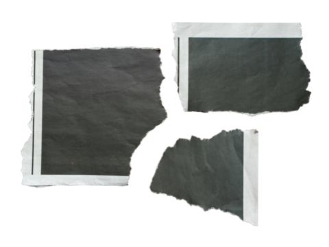 Torn black newspaper