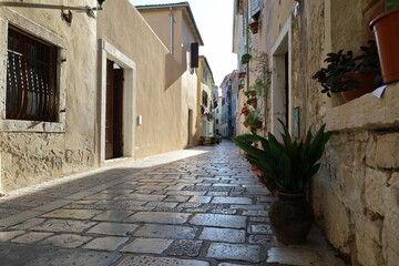  Street of Porec in Croatia, Istria. Architecture of Croatia. Narrow street with croatian houses in...
