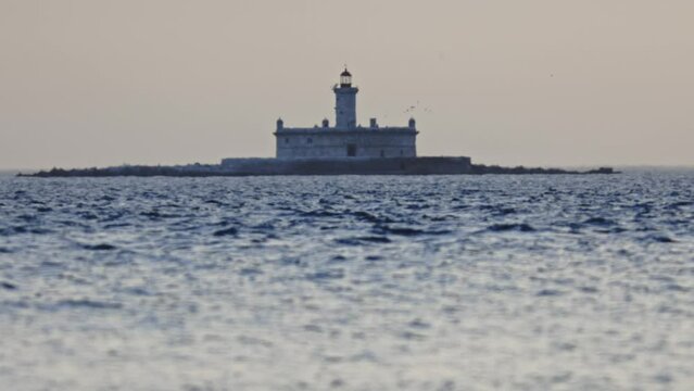 Bugio Lighthouse at cloudy grey weather