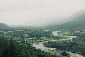 Fototapeta na wymiar High view of river through the forest