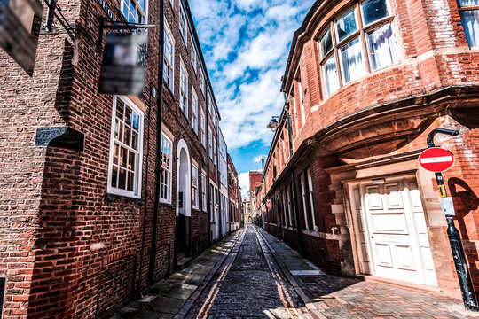 Narrow street with brick buildings in Hull