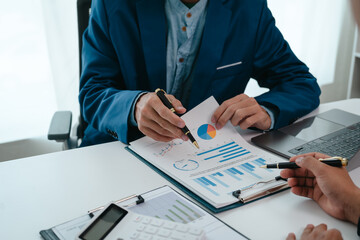 A team of young entrepreneurs and Asian startups held a business meeting. to achieve the marketing...