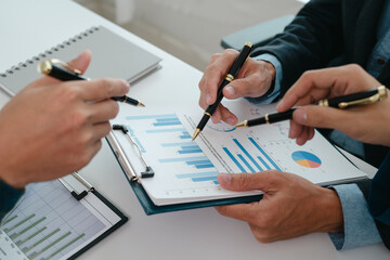 A team of young entrepreneurs and Asian startups held a business meeting. to achieve the marketing plan Businessmen talking in a conference room. Business. Population. Company.