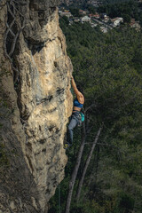 Woodland Ascent: Female Rock Climber in the Heart of Nature