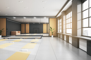 Contemporary group class in gym interior with yoga mats, mirror with reflections, window with city view and daylight. 3D Rendering.