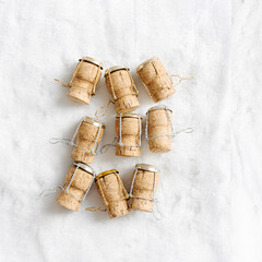 Minimal trend pattern New Year, xmas concept, wine corks from champagne sparkling wine on white fur background, bottle stoppers festive drinks, Aesthetic still life, winter holidays photo