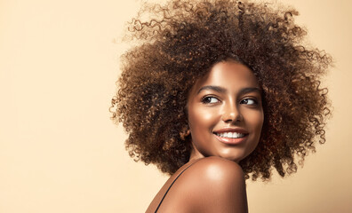 Beautiful black woman . Beauty portrait of african american woman with clean healthy skin on beige...