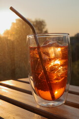 glass of aperol spritz at the sunset
