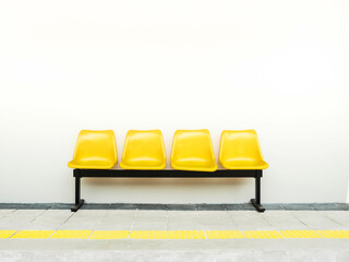 row of yellow chairs in a row